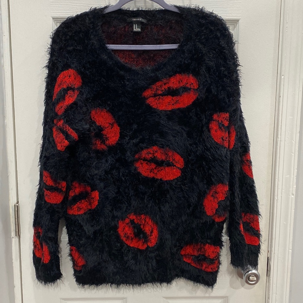 Furry sweater with red lipstick print.